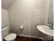 Small bathroom with toilet, sink, and vanity at 8112 Derby Woods Ln, Charlotte, NC 28214