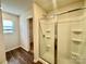 Bathroom with shower and closet access at 8112 Derby Woods Ln, Charlotte, NC 28214