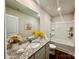 Bathroom with granite countertop and bathtub at 8112 Derby Woods Ln, Charlotte, NC 28214