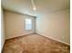Simple bedroom with neutral walls and carpet at 8112 Derby Woods Ln, Charlotte, NC 28214