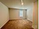 Spacious bedroom with neutral walls and carpet at 8112 Derby Woods Ln, Charlotte, NC 28214