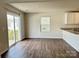 Spacious dining area with wood floor and patio access at 8112 Derby Woods Ln, Charlotte, NC 28214