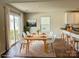 Dining area with wood floors and sliding glass doors to patio at 8112 Derby Woods Ln, Charlotte, NC 28214