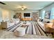 Living room with neutral carpeting and ample natural light at 8112 Derby Woods Ln, Charlotte, NC 28214