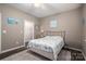 Bedroom with a queen bed, ceiling fan, and walk-in closet at 8176 Viscount Ct, Denver, NC 28037