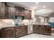 Updated kitchen with dark wood cabinets and granite countertops at 8176 Viscount Ct, Denver, NC 28037