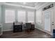 Home office with desk, chair, and ample natural light at 8176 Viscount Ct, Denver, NC 28037
