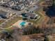 Community pool and clubhouse with surrounding landscaping at 8176 Viscount Ct, Denver, NC 28037