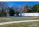 Community tennis court with surrounding fence and landscaping at 8176 Viscount Ct, Denver, NC 28037