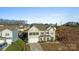 Two-story house with beige siding and a two-car garage, viewed from above at 10045 Carousel Corral Dr, Midland, NC 28107