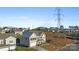 Two-story house with beige siding and a two-car garage, viewed from above at 10045 Carousel Corral Dr, Midland, NC 28107