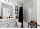 Modern bathroom with gray vanity, bathtub, and shower at 10045 Carousel Corral Dr, Midland, NC 28107