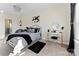 Elegant bedroom with a queen-size bed and a chic desk setup at 10045 Carousel Corral Dr, Midland, NC 28107