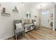 Bright entryway with decorative console table, two chairs, and a mirror at 10045 Carousel Corral Dr, Midland, NC 28107