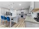 Island kitchen with granite counters and blue chairs at 10045 Carousel Corral Dr, Midland, NC 28107