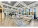 Spacious living room with sectional sofa and large windows at 10045 Carousel Corral Dr, Midland, NC 28107