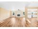 Bright living room featuring a fireplace and kitchen view at 1006 Woodside Dr, Kings Mountain, NC 28086