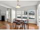 Bright dining area featuring hardwood floors, natural light, and neutral decor at 10430 Samuels Way Dr, Huntersville, NC 28078