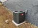 Goodman air conditioning unit against a painted brick wall at 107 Meadow Ne Ave # 7, Concord, NC 28025