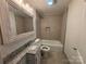 Updated bathroom with granite vanity and a bathtub at 107 Meadow Ne Ave # 7, Concord, NC 28025