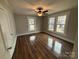 Bedroom with hardwood floors and ceiling fan at 107 Meadow Ne Ave # 7, Concord, NC 28025