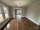 Dining room with hardwood floors and a chandelier at 107 Meadow Ne Ave # 7, Concord, NC 28025