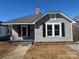 Charming single-Gathering home features a cozy front porch and a well-maintained yard, offering classic curb appeal at 107 Meadow Ne Ave # 7, Concord, NC 28025