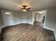 Hardwood floors, neutral walls, and views into dining room and kitchen at 107 Meadow Ne Ave # 7, Concord, NC 28025