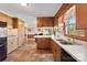 Kitchen with wood cabinets, tile flooring, and breakfast bar at 121 Putnam Lake Rd, Kings Mountain, NC 28086