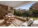 Outdoor balcony featuring an outdoor kitchen with a stainless steel grill and dining area at 130 Cherokee Rd # 104, Charlotte, NC 28207