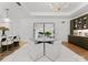 Bright dining area features modern lighting, stylish furniture, and hardwood floors at 130 Cherokee Rd # 104, Charlotte, NC 28207