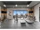 Bright fitness center with treadmills, stationary bikes, and a view of the outdoor terrace at 130 Cherokee Rd # 104, Charlotte, NC 28207