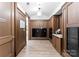 Well-lit hallway with wood paneled walls and secure mailboxes for residents at 130 Cherokee Rd # 104, Charlotte, NC 28207