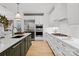 Bright kitchen boasts a large island, stainless steel appliances, and ample counter space at 130 Cherokee Rd # 104, Charlotte, NC 28207
