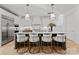 Modern kitchen boasts a spacious island with bar seating and pendant lighting at 130 Cherokee Rd # 104, Charlotte, NC 28207