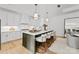 Beautiful, light-filled kitchen with ample seating, modern appliances, and a stylish island at 130 Cherokee Rd # 104, Charlotte, NC 28207
