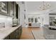 Bright living room with hardwood floors, fireplace, and views of the lush surroundings at 130 Cherokee Rd # 104, Charlotte, NC 28207