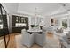 Open-concept living area with dining space, modern decor, and a cozy fireplace at 130 Cherokee Rd # 104, Charlotte, NC 28207