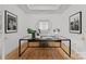 Modern home office featuring a glass-top desk and natural light at 130 Cherokee Rd # 104, Charlotte, NC 28207