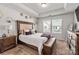 Comfortable bedroom with a large bed, natural light, and warm, inviting décor at 1342 Galloway Rd # 132, Charlotte, NC 28262