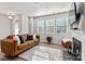 Bright and airy living room with a fireplace, large windows, and a comfortable sofa at 1342 Galloway Rd # 132, Charlotte, NC 28262