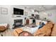 Open-concept living area with a fireplace, TV, and seamless transition to the modern kitchen at 1342 Galloway Rd # 132, Charlotte, NC 28262