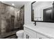 Bathroom with gray tile shower, white vanity, and black accents at 13453 Portside Ln, Lancaster, SC 29720