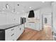 Modern kitchen with white cabinets, black countertops, and stainless steel appliances at 13453 Portside Ln, Lancaster, SC 29720