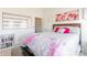 Bright bedroom with double bed, built-in shelving and large wall art at 13871 Clayborn St, Midland, NC 28107