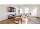 Living room with hardwood floors, sofa and flat screen tv at 13871 Clayborn St, Midland, NC 28107