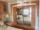 Bedroom with mirrored closet and oak cabinets at 140 Landlubber Trl # H73, Mount Gilead, NC 27306