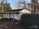 Home exterior with covered parking and shed at 140 Landlubber Trl # H73, Mount Gilead, NC 27306