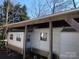 Exterior of a mobile home featuring multiple windows and covered parking area at 140 Landlubber Trl # H73, Mount Gilead, NC 27306