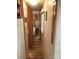 Hallway with wood floors leading to the bedroom at 140 Landlubber Trl # H73, Mount Gilead, NC 27306